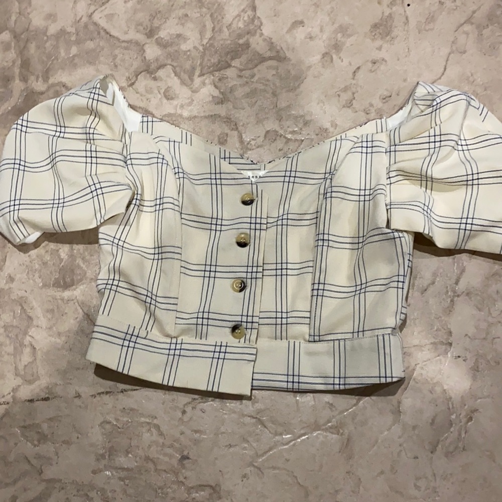 This is a sense mill button up blouse.
